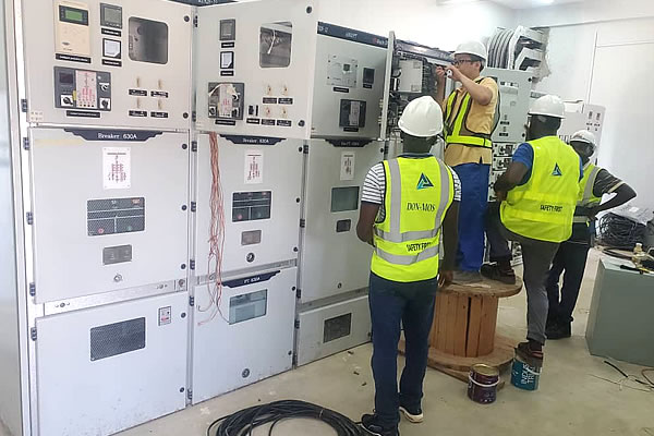 DON-MOS GLOBAL TECHNOLOGIES technicians installing industrial control systems